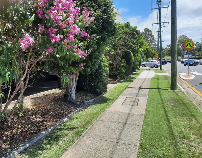 Weed-free garden bed and verge beside a commercial car park