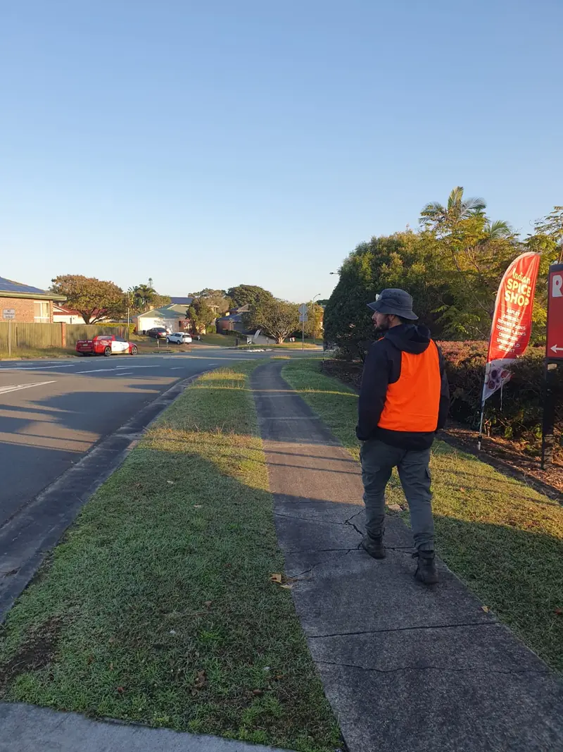 A&V crew member in hi-vis working along a verge in Wishart