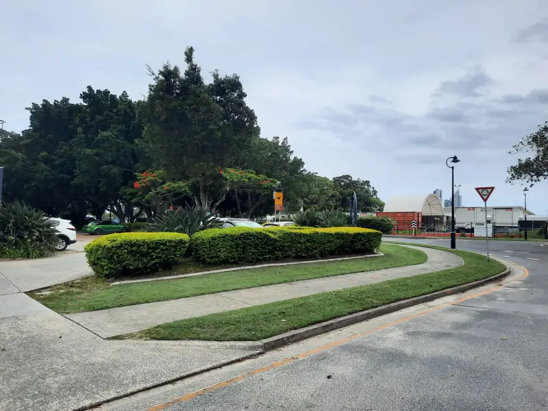 Shaped hedges and mown turf around a roundabout garden
